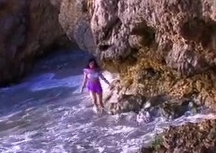 Nice beach sex with a French lanuginose brunette taking things in her own hands jerking it increased by receiving a for detail hot load on her face