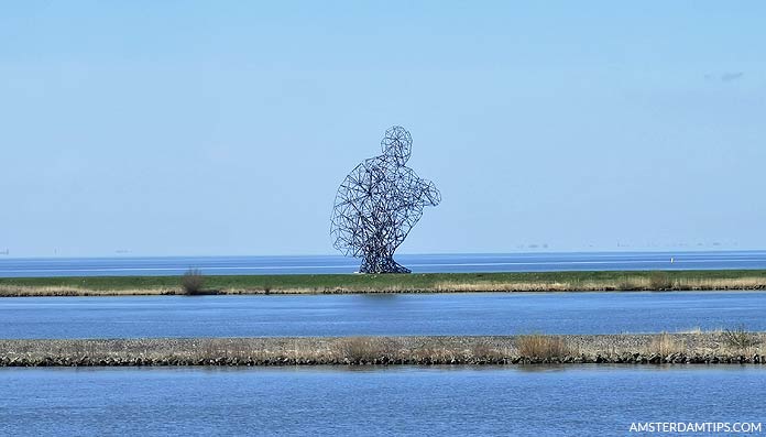 crouching man lelystad by antony gormley