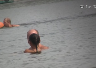 Mature women unexceptionally undecorated sunbathing on the beach