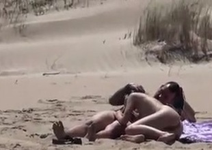 Couple surpassing a nude beach