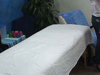 Blond beauty takes off garments and lingerie slowly and then lies on massage table. Handsome masseur enters the room and this babe becomes turned on seeing him. The girlie makes a decision to seduce him to fuck herЕ