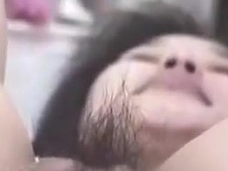 Korean floozy with big pussy and pouty lips gets wicked on camera. This babe stuffs her hairy pussy with fingers, metal balls and even a bottle. This muff can swallow a lot of ball cream too!