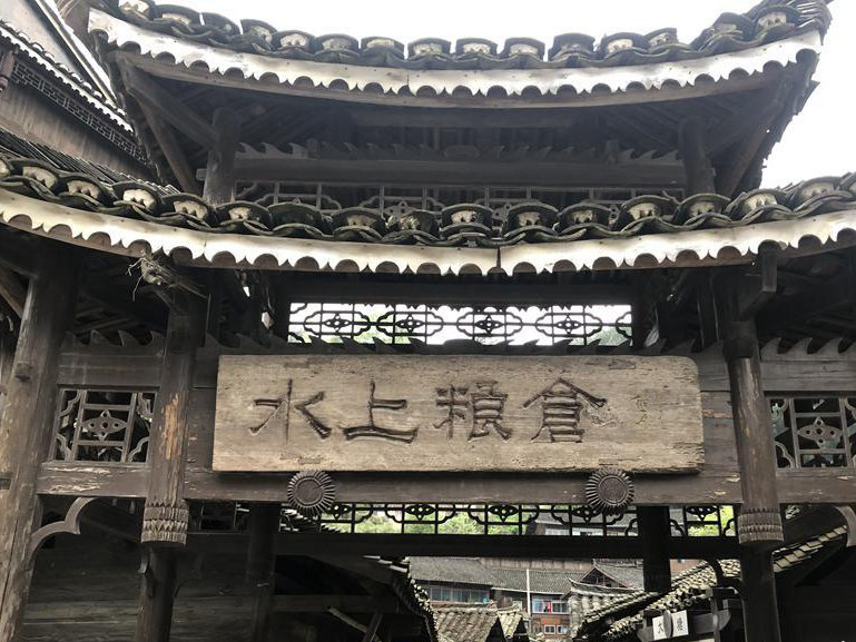 Barns built above water keep grain safe in Miao village