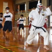 With a fighting shout accompanied with Music, Bunshiro Nagamine leads “Radio Karate” at Yaesekotoshien School