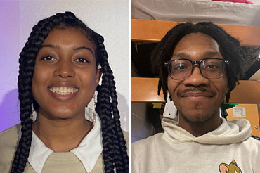 Black woman and a black man smiling for the camera.