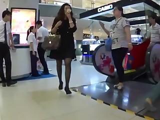 Chinese dude cum on girl skirt in the department store