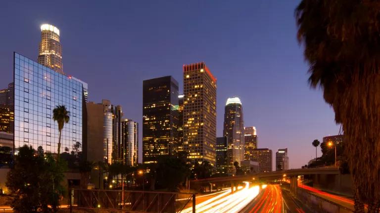 Los Angeles downtown at dusk, with the 110 freeway in the foreground Los Angeles downtown at dusk