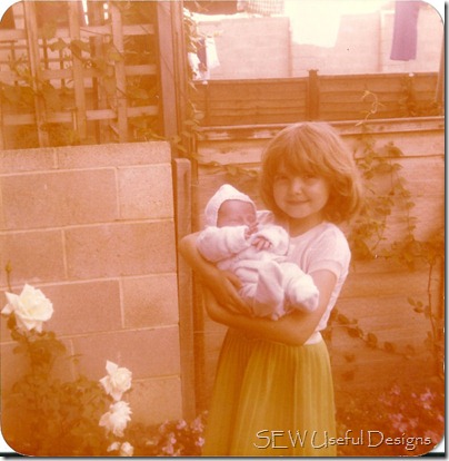 Vikki age 4 holding babe