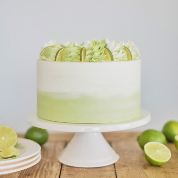 Mojito Cake: tender and fluffy white cake layers infused with lime and mint, with a lime curd and mint buttercream. #cakebycourtney #mojitocake #summercake #cake #cakerecipe #easycakerecipe #mojito