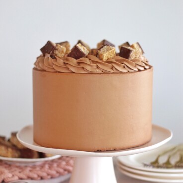 Scotcheroo Cake - caramel peanut butter cake layers with chocolate butterscotch buttercream #cake #cakerecipe #scotcheroo #scotcheroocake #scotcheroorecipe