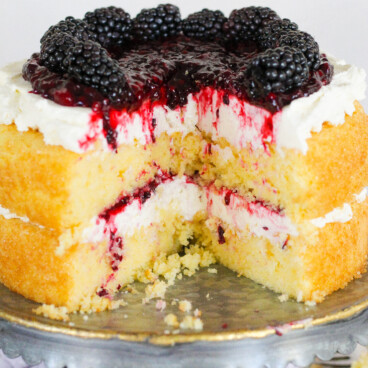 Two layered cornbread cake on a cake stand.