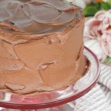 Small cake on a pink cake stand.