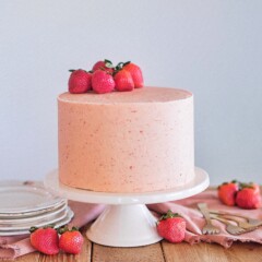 Strawberry Shortcake: Tender and fluffy layers of vanilla cake, filled with whipped cream and fresh strawberries, and covered in a strawberry buttercream. #cakebycourtney #cake #cakerecipe #strawberryshortcake #shortcake #strawberry #buttercream