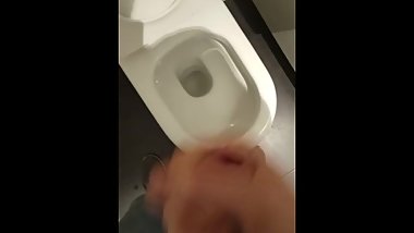 Jerking off in a public bathrooms