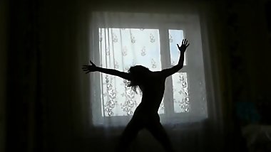 Natasha Shy dances sexy dance on the window background