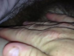 wifes bushy bush under the sheets.