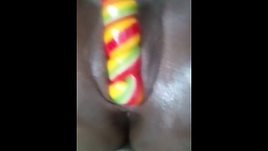 Ebony Teen Masturbates with a lollipop until it melts