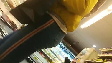 Round ass in tight jeans doing the groceries.