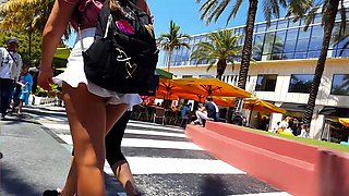 Street voyeur follows a hot brunette teen with a perfect ass