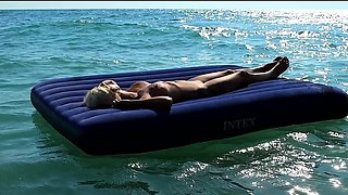 I Watched on the Beach How a Naked Girl with Big Tits Was Sunbathing on a Mattress. Slow Motion