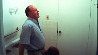 Bathroom slut sucks dick in restroom