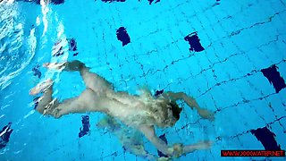 Blonde in a dress in a pool