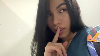 Lustful Latina nurse in uniform masturbates in a public restroom