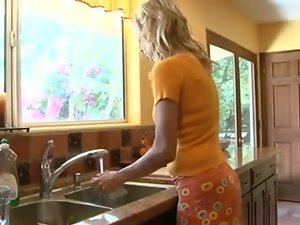 Tempting blonde Mommy in the kitchen