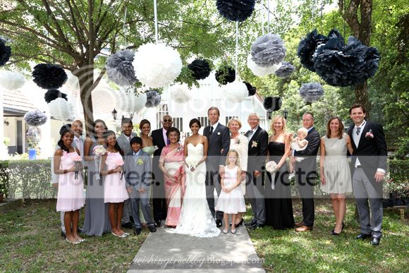 Giant flower pom poms floating overhead. giant flower pom poms, floating pom poms, monochromatic, garden wedding